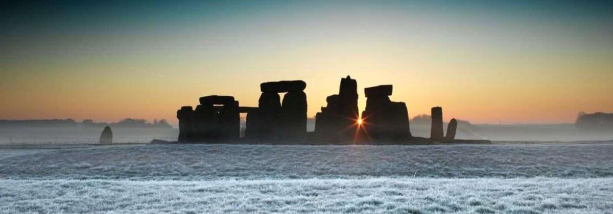 panoramic shot of the Stonehenge monument during a winter sunset