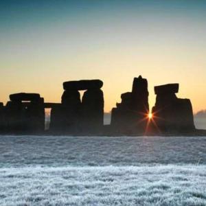 panoramic shot of the Stonehenge monument during a winter sunset